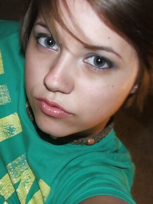 Beautiful short-haired amateur babe shows her big boobs in a solo