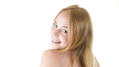 Teen girl with red hair removes her black...